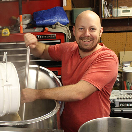 Gerad Coles, Founder and Brewmaster of Prairie Dog Brewing mashing in.