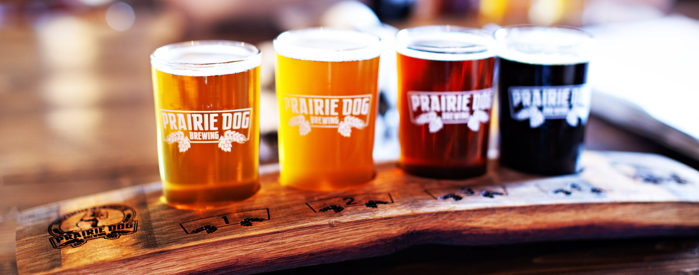 Prairie Dog Flight of 4 Craft Beers on Oak Stave Flight Paddle