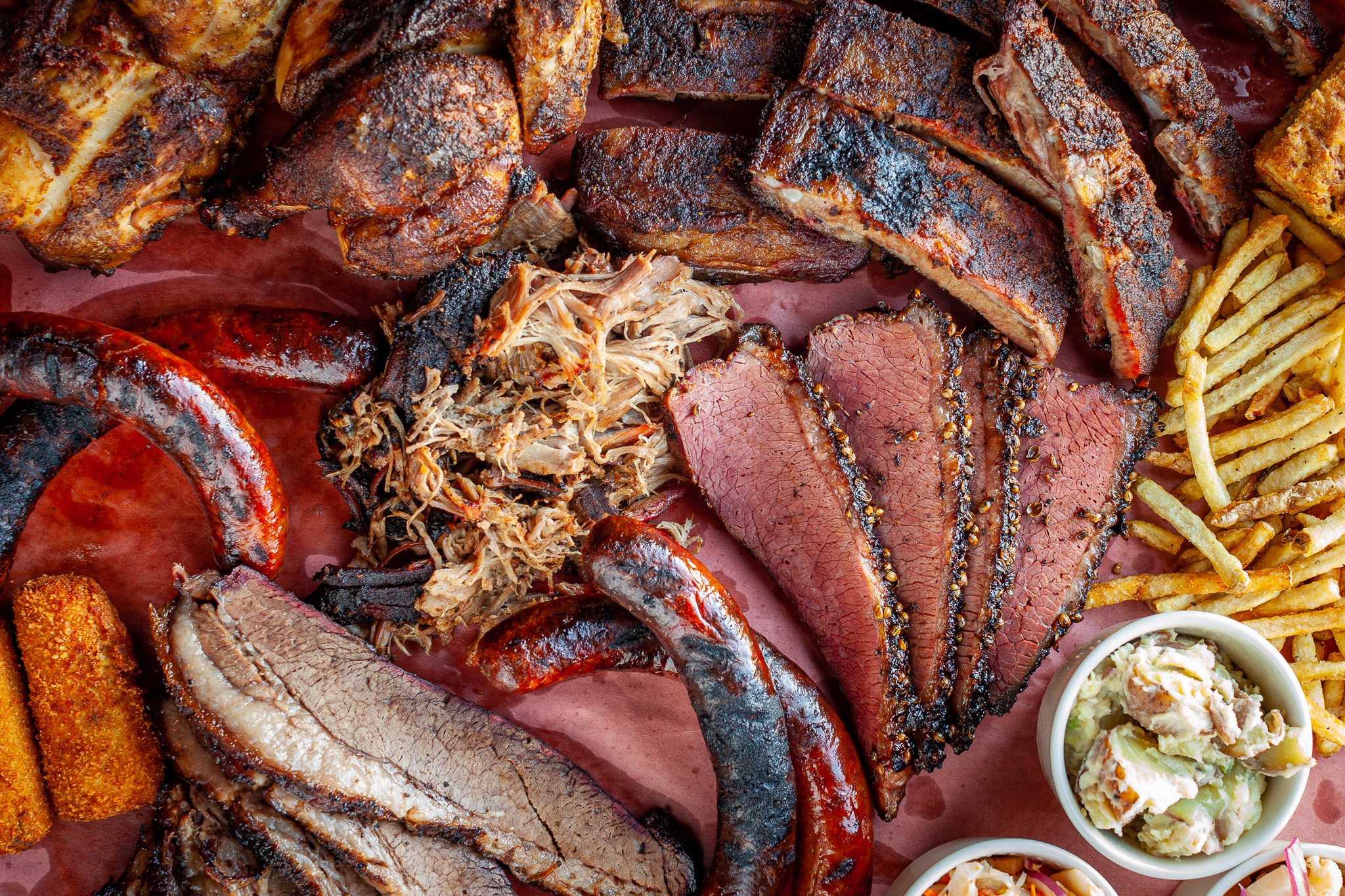 Prairie Dog's Fuller Pit Barbecue Platter - closely zoomed in to show the amazing texture and colour in our meat products.