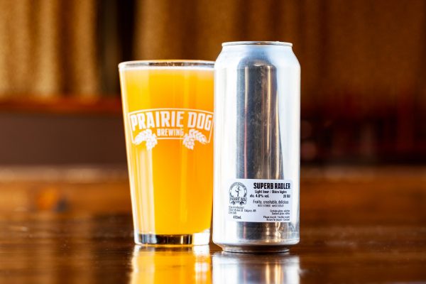 A 473-ml can of Prairie Dog Super-B Hazy Wheat ale, blended with orange and cranberry juices, to produce a fruity, quenching low-alcohol beverage with pleasant bread undertones.