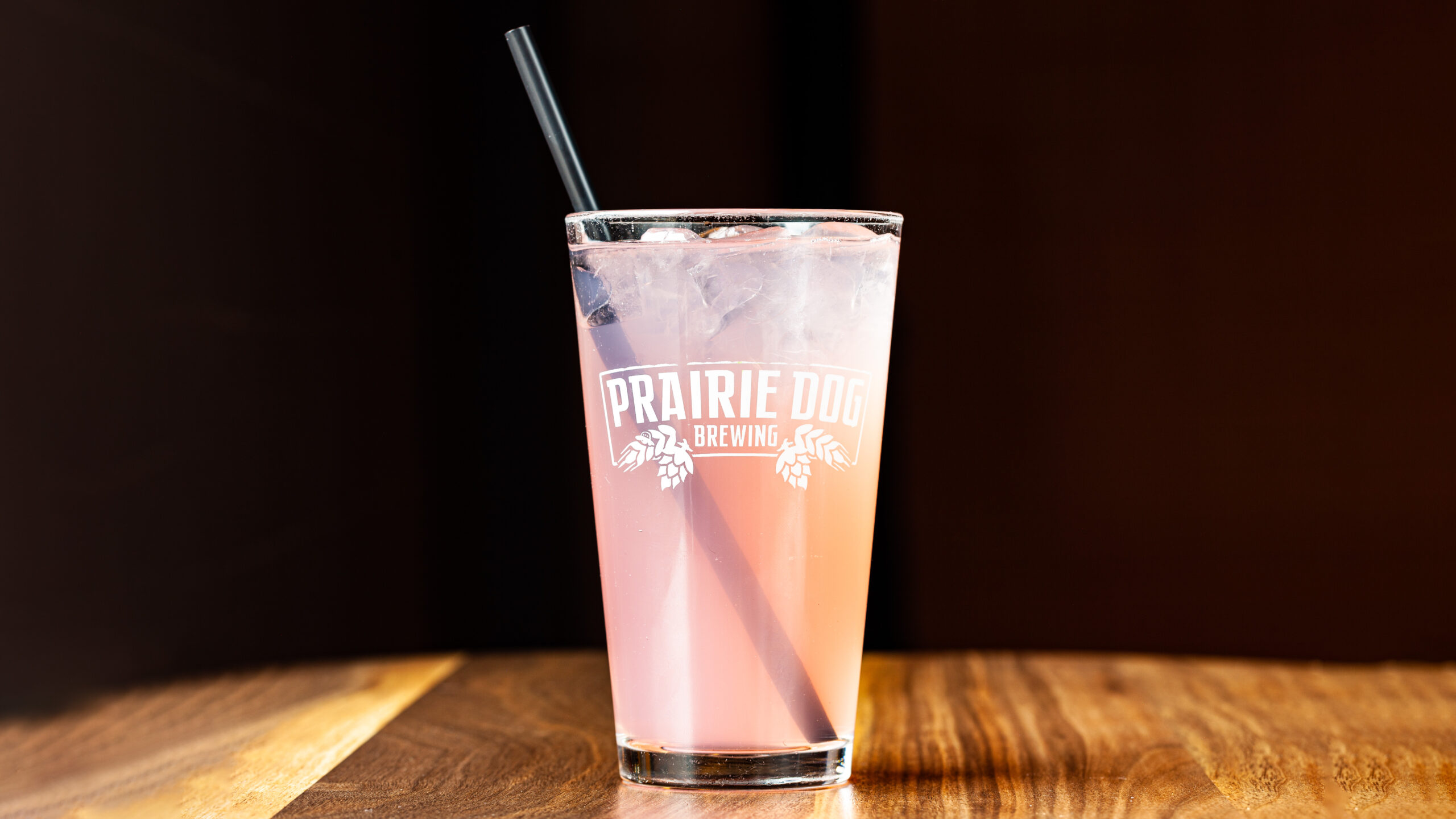 A delicious glass of Prairie Dog's pink Lemonade, a dine-in treat.
