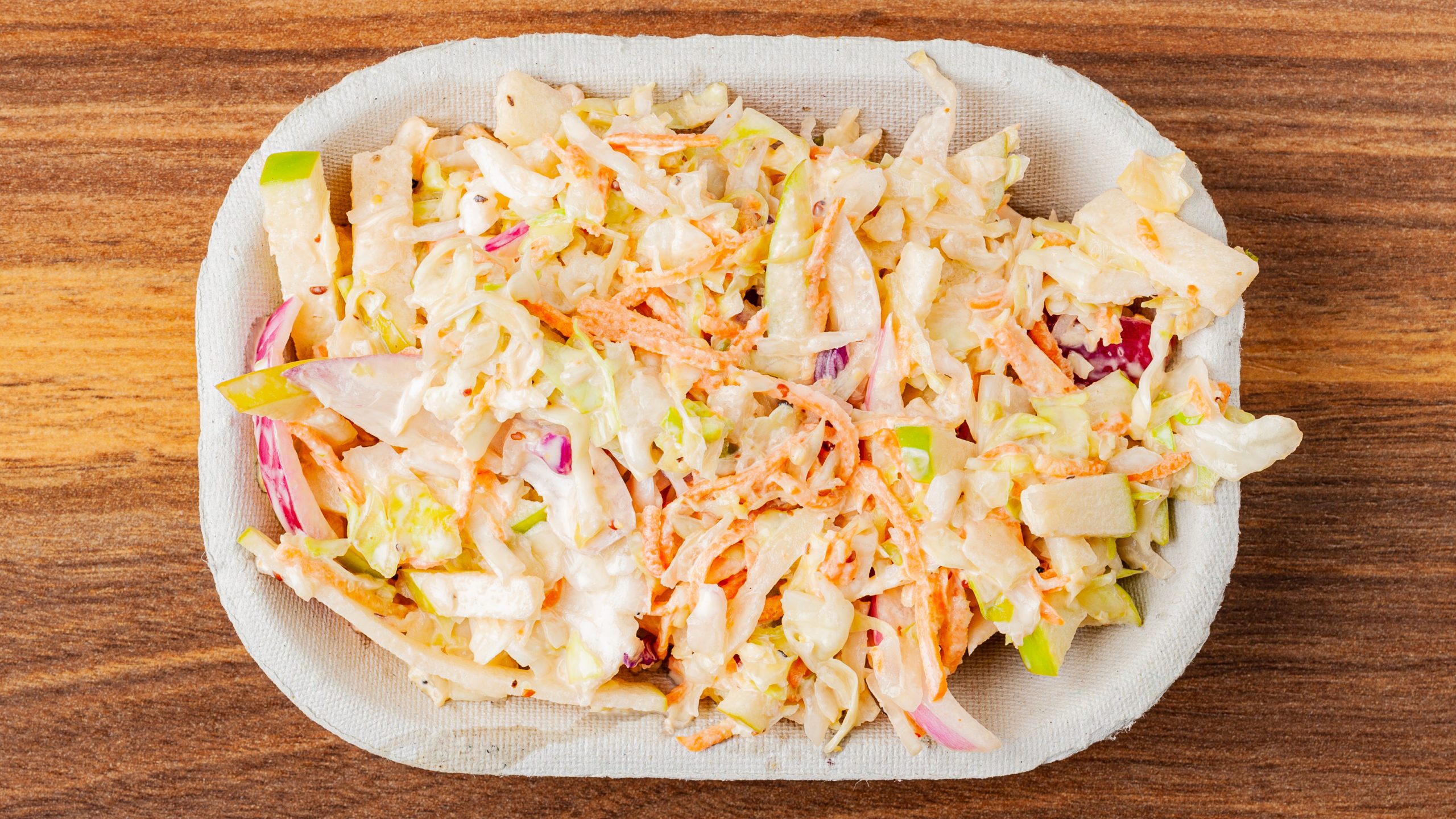 Prairie Dog Brewing's house coleslaw with apples, cabbage, carrot and red onion in a zesty dressing.