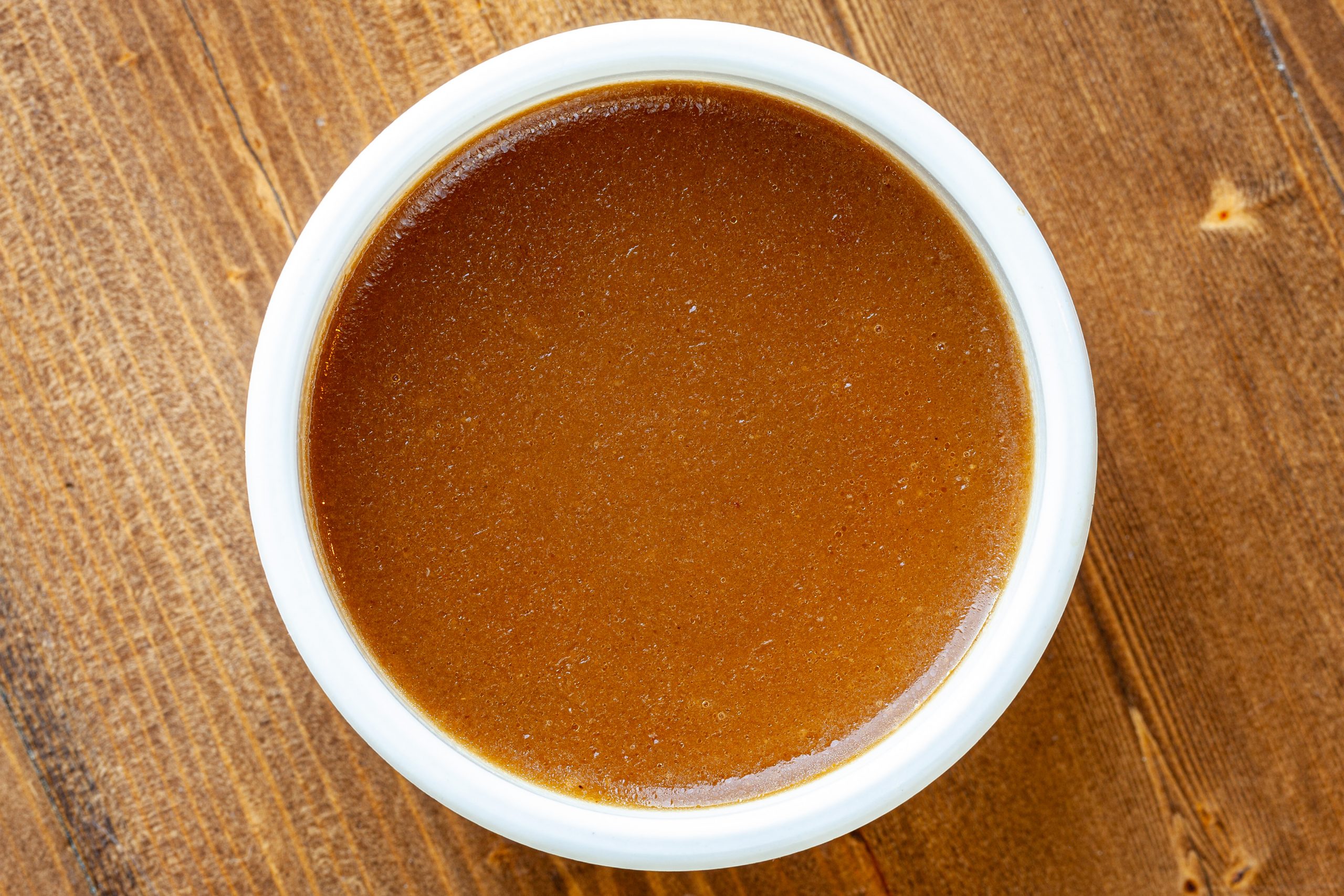 4-oz portion of beef gravy in a ramekin