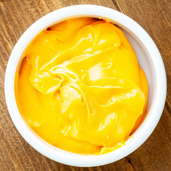 4-oz portion of nacho cheese dip in a ramekin