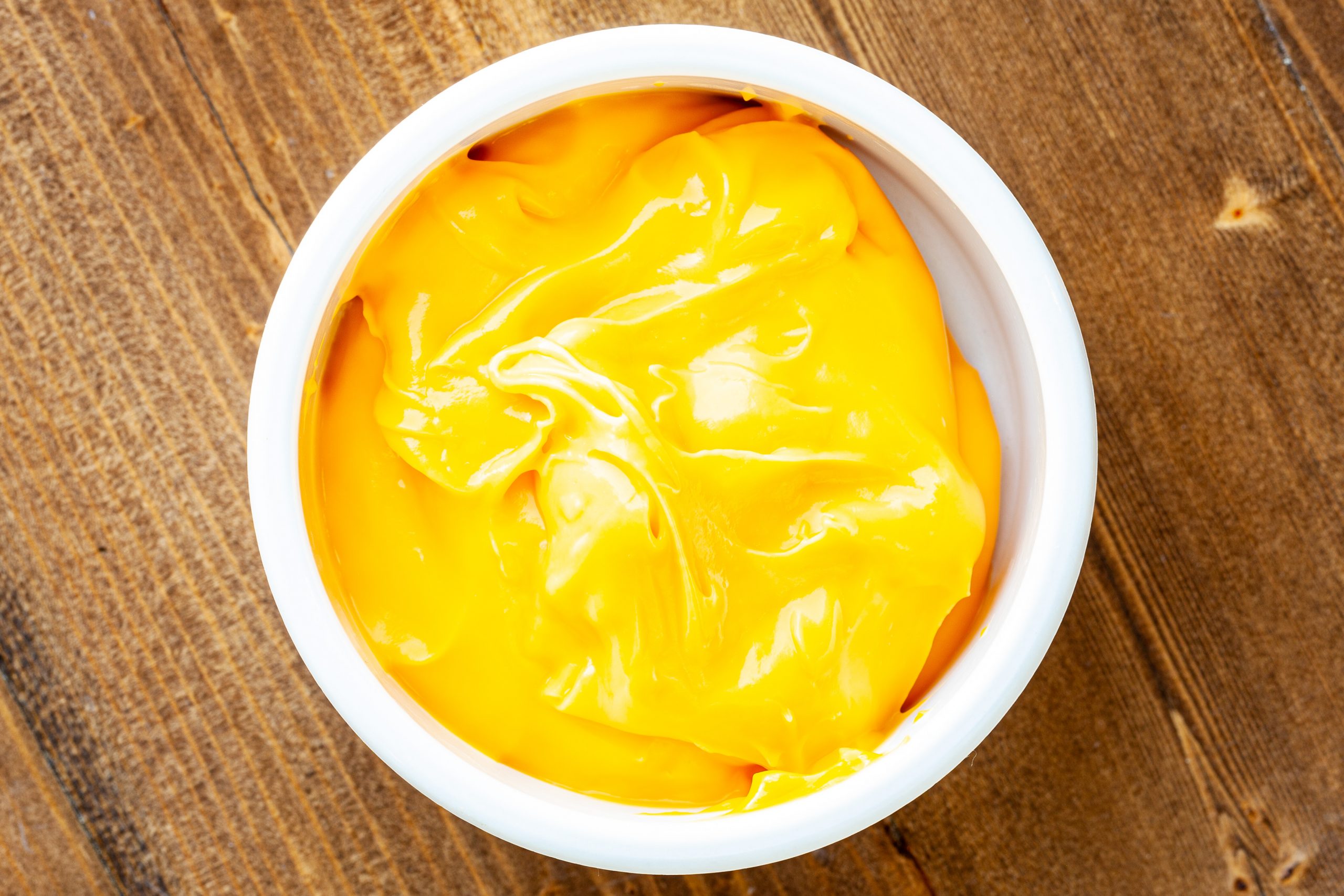 4-oz portion of nacho cheese dip in a ramekin