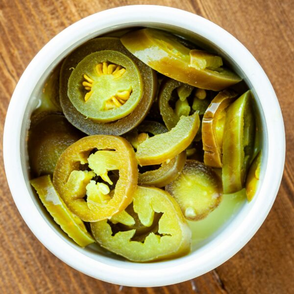 Pickled, diced jalapeños in a side ramekin