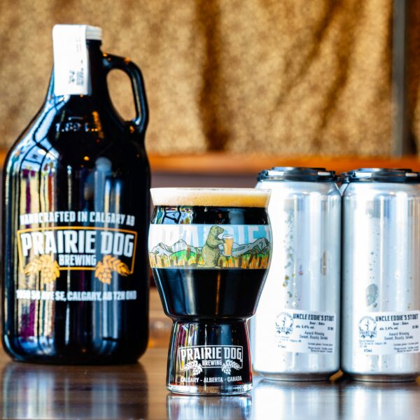 Prairie Dog Brewing's Uncle Eddie's Stubborn (Oatmeal) Stout in a 16oz glass, 473mL cans and 64oz growler