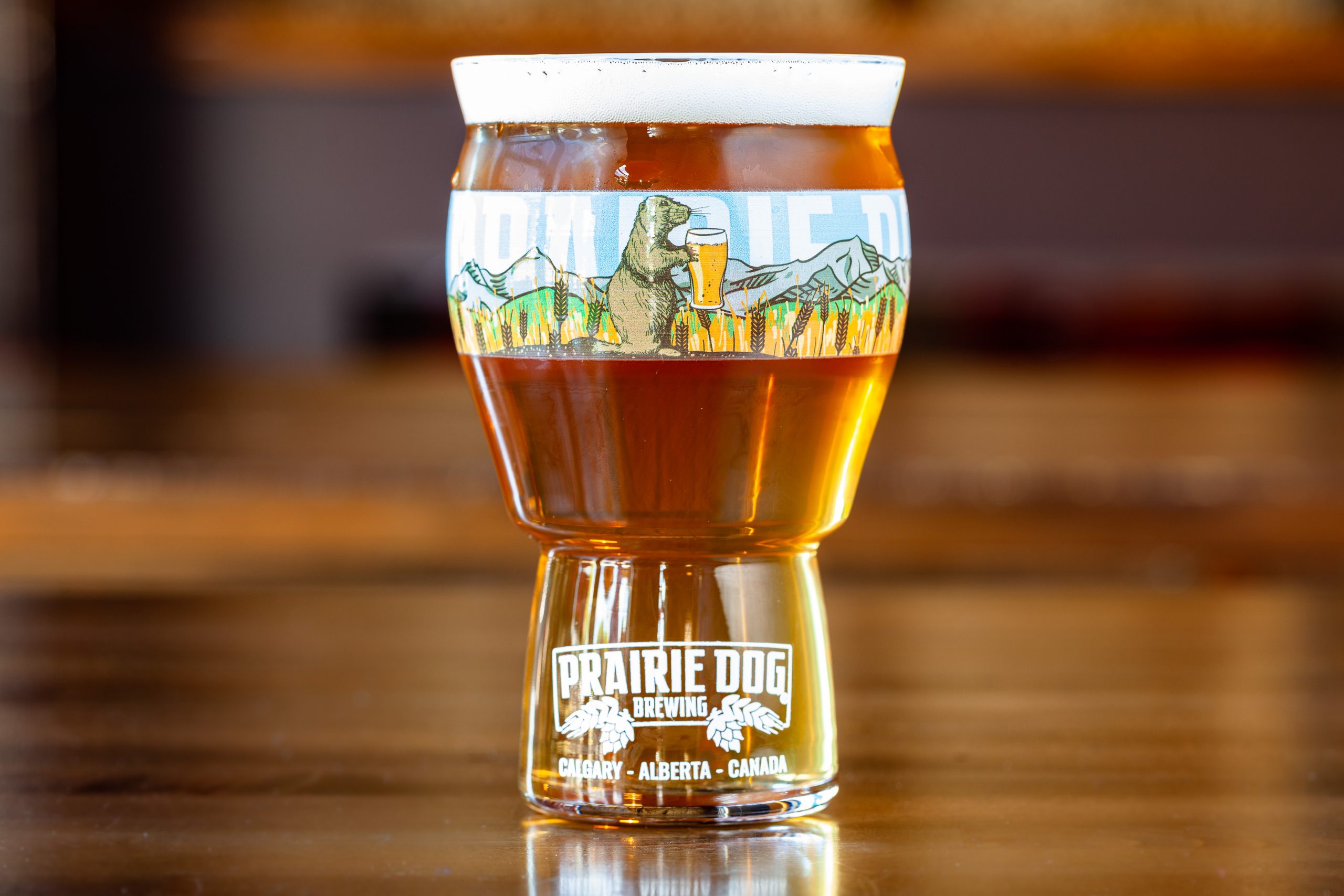 Prairie Dog Brewing's experimental Sunrise Prelude wild/sour saison in a branded 16-oz US pint glass.