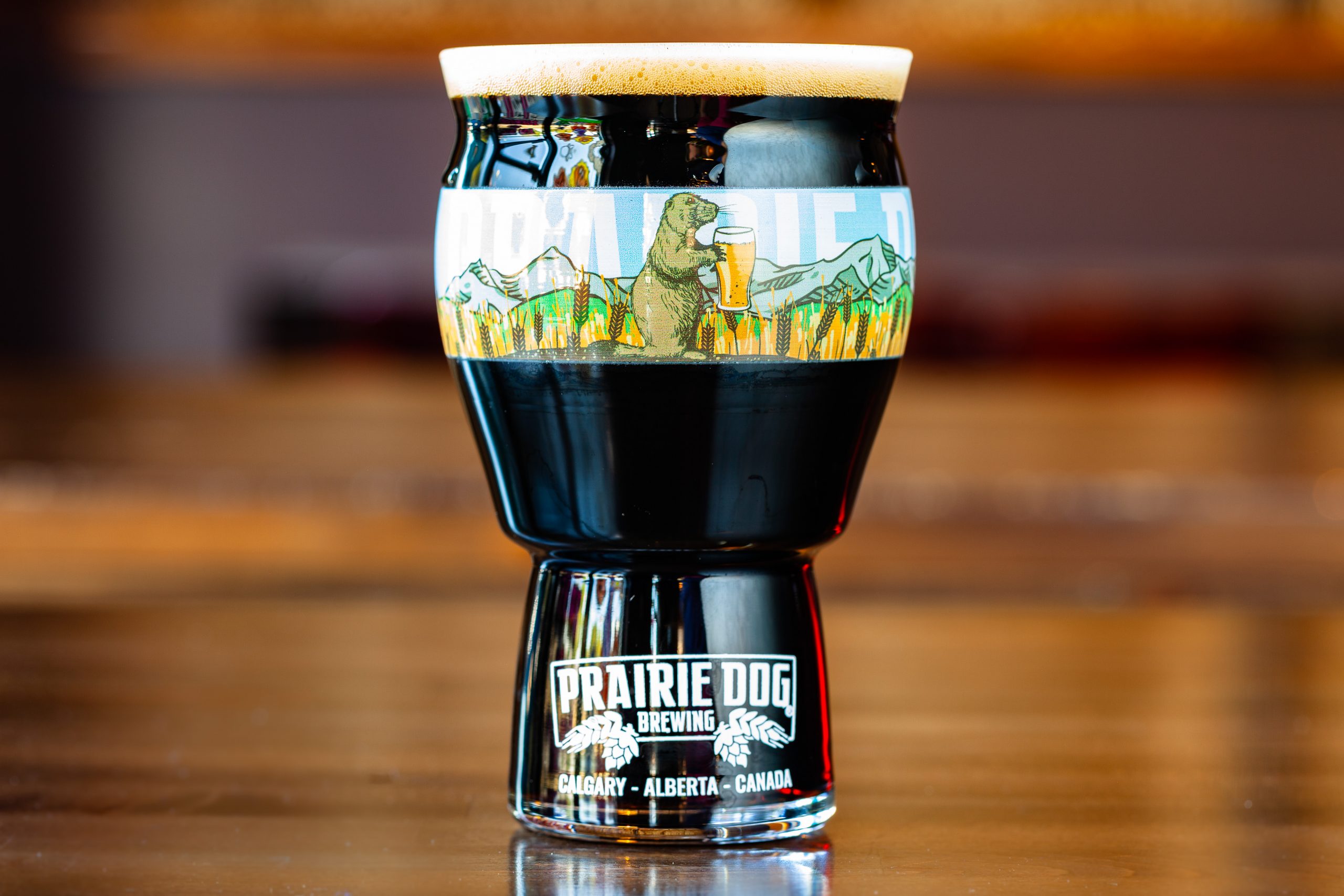 Prairie Dog Brewing's Uncle Eddie's Stubborn (Oatmeal) Stout in a branded 16-oz US pint glass.