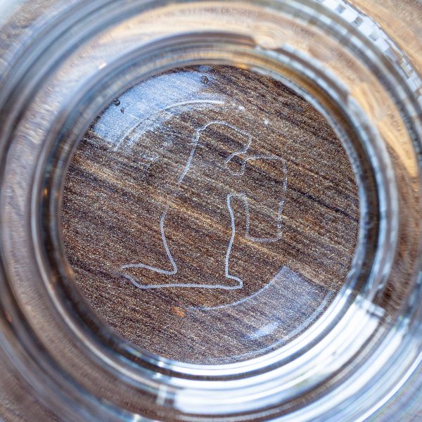 A close-up view of the nucleated bottom of our Prairie Dog Brewing 16-oz Craftmaster Grand branded glassware. Nucleation outline is our Prairie Dog mascot, Alby.
