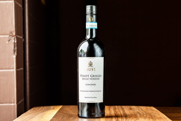 A 750-mL bottle of Giusti Longheri Pinot Grigio delle Venezie red wine.