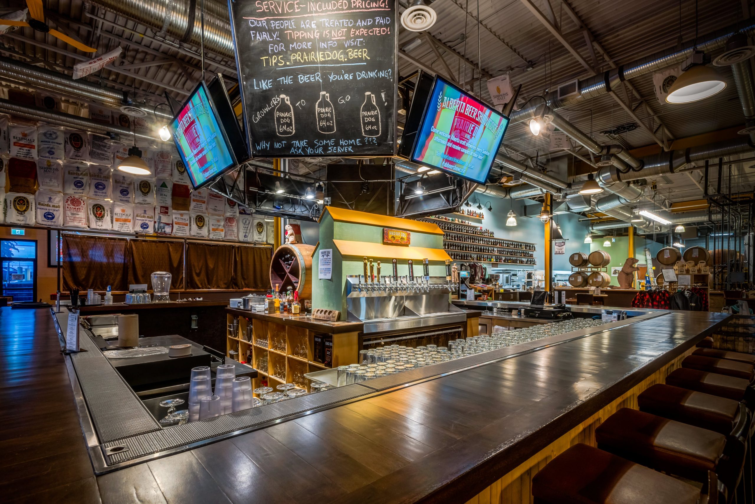 Prairie Dog Brewing's Front of House and Bar Area, with grain elevator tap tower and four TV's.