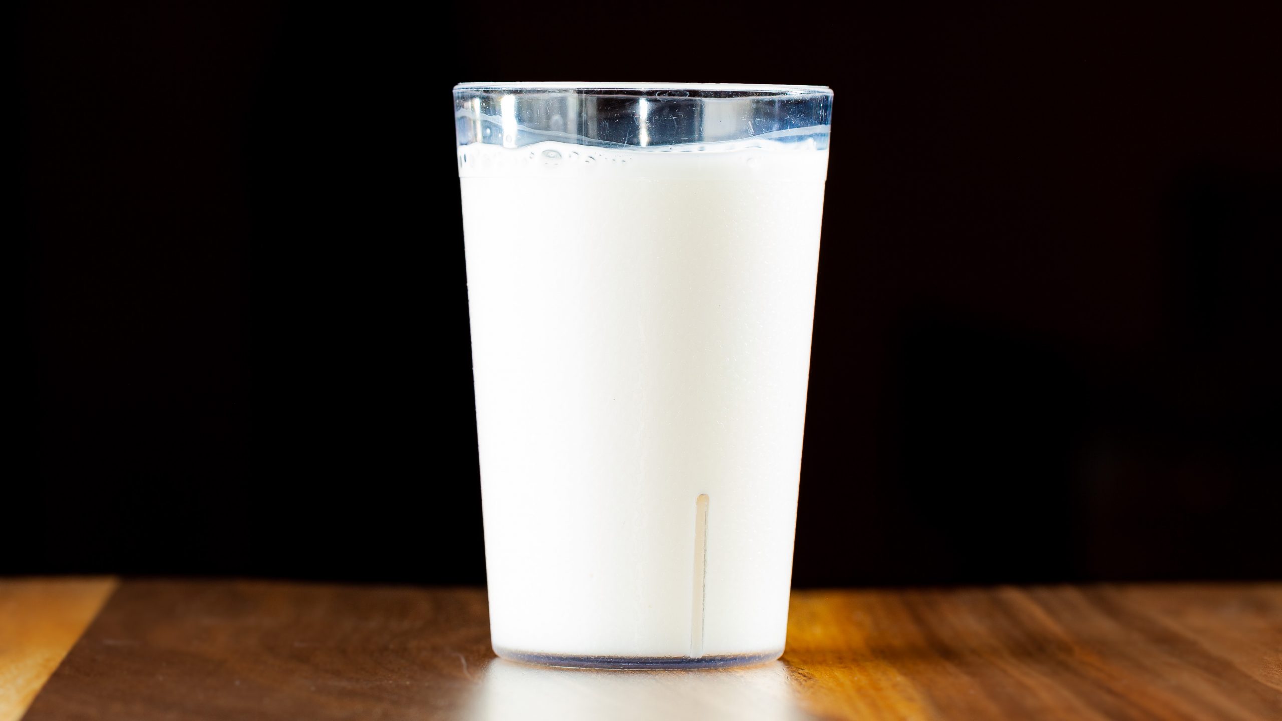 An 8-oz glass of kids milk.