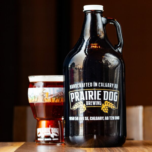 A 64-oz growler of Prairie Dog Brewing Prairie Lands Lager with an example draft pour.