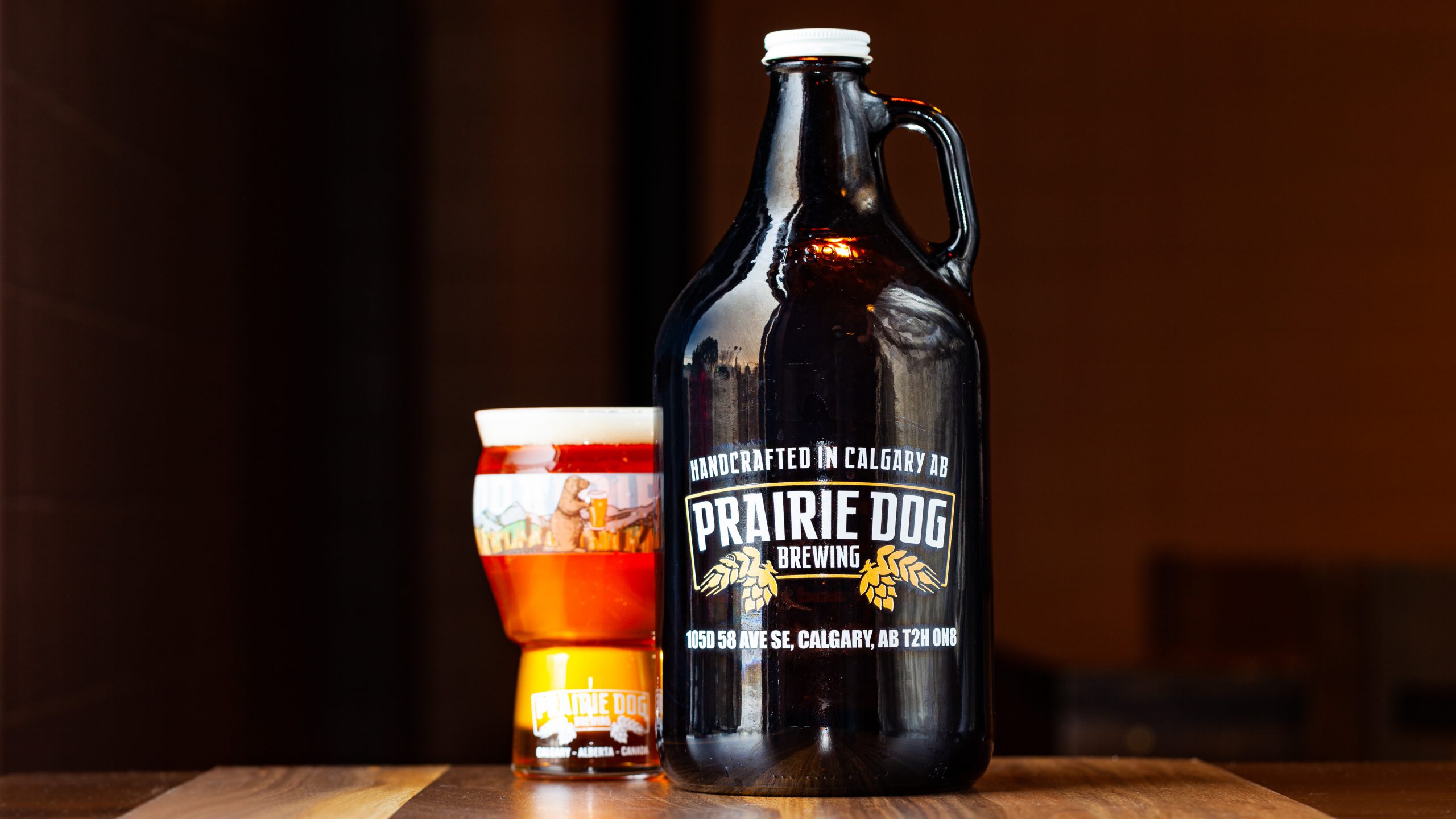 64-oz Growler of Prairie Dog Brewing Harvest Pale Ale, with a draft pour example.