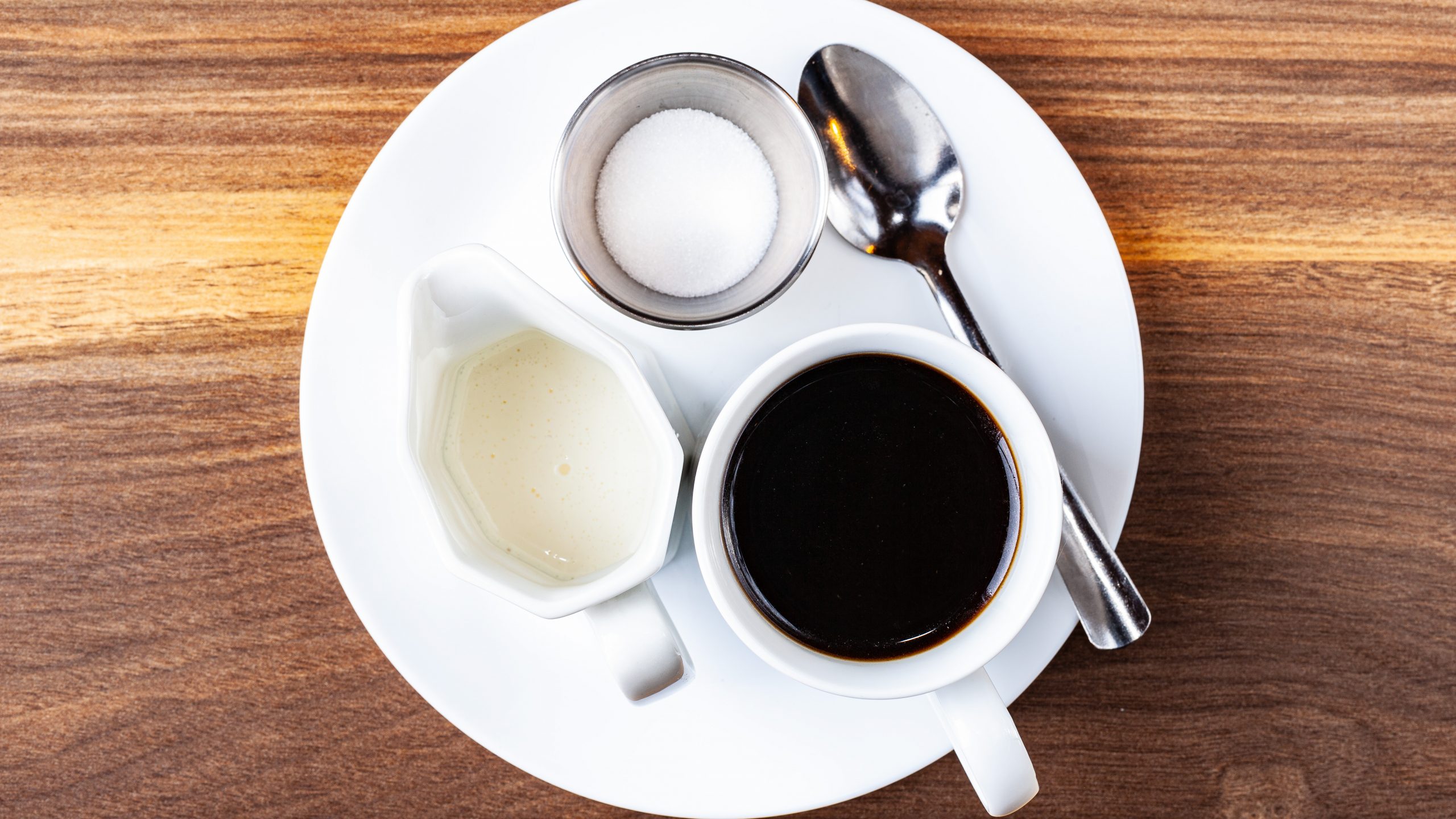 A cup of premium drip coffee, cream and sugar from Prairie Dog Brewing.