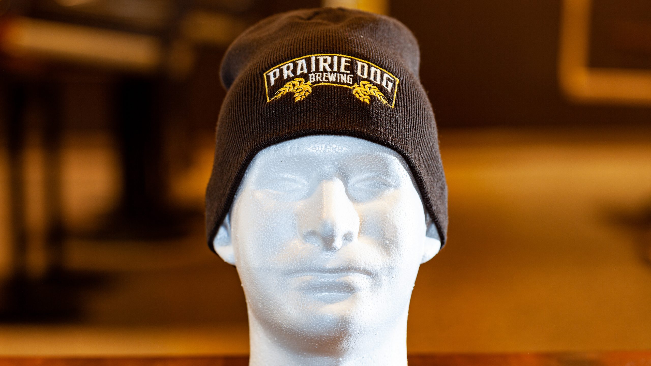 Prairie Dog Brewing's basic brown beanie-style toque with embroidered logo.