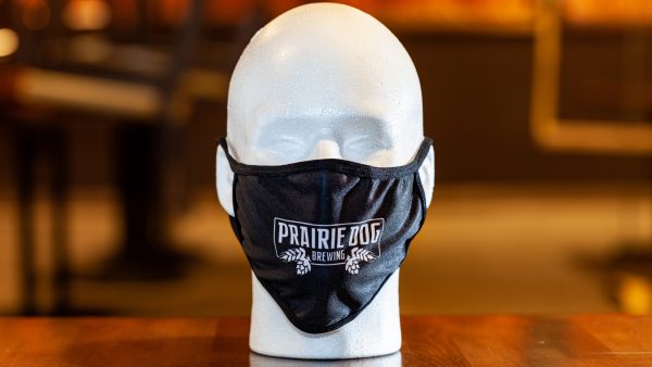 A branded Prairie Dog Brewing reusable cloth face mask, in black colour.