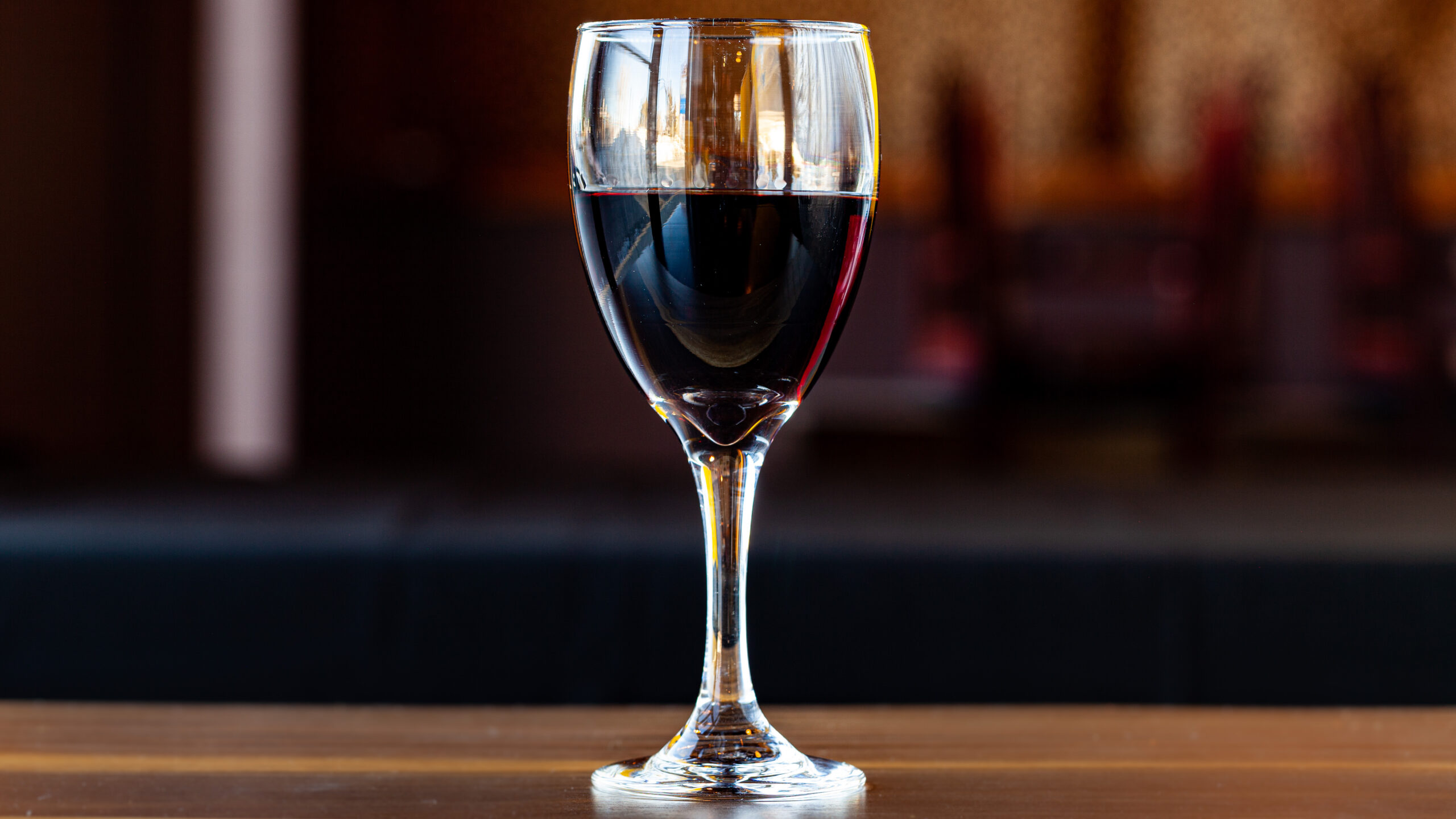 A 5-oz pour of Prairie Dog Brewing's house red wine in stemware.