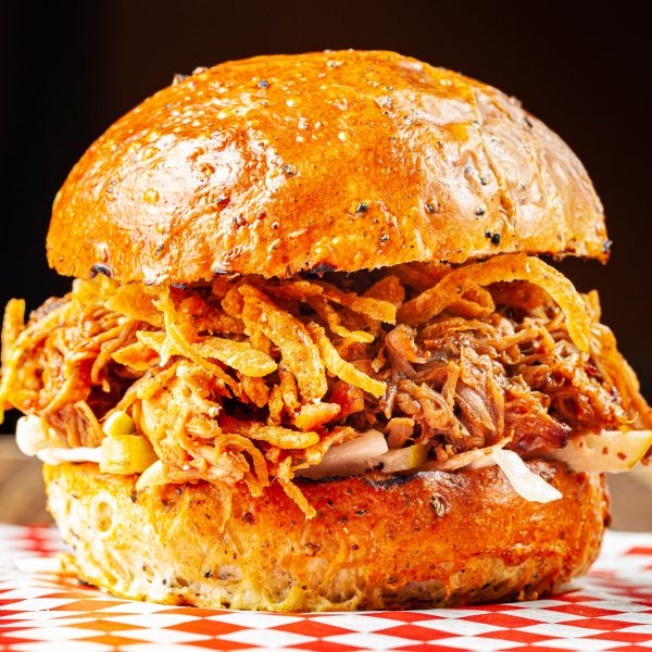 Prairie Dog Brewing's Alberta Red Pulled Pork Sandwich with pulled pork, barbecue sauce, apple slaw and crispy onions.