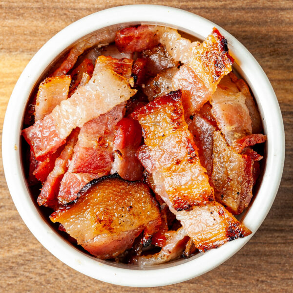 A side ramekin filled with Prairie Dog Brewing's delicous sliced bacon, served as an add-on.
