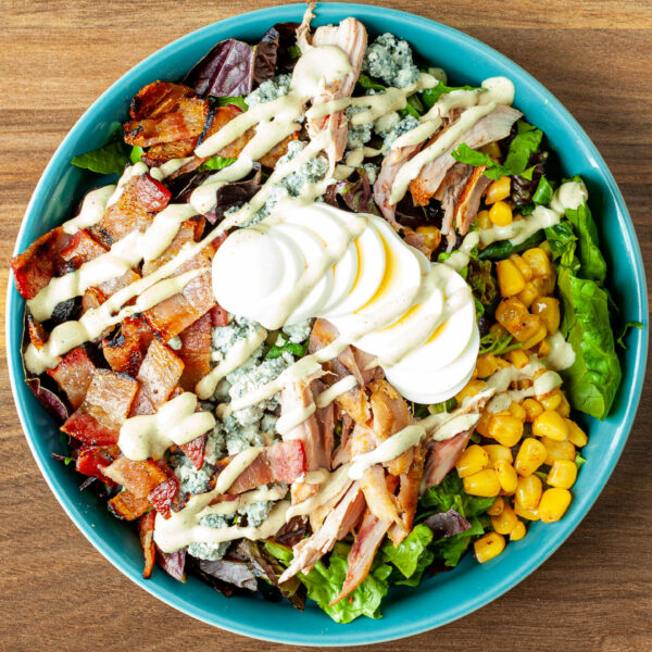 Prairie Dog Brewing's Prairie Cobb Salad with artisan romain lettuce, chopped bacon, smoked chicken, blue cheese crumble and much more.