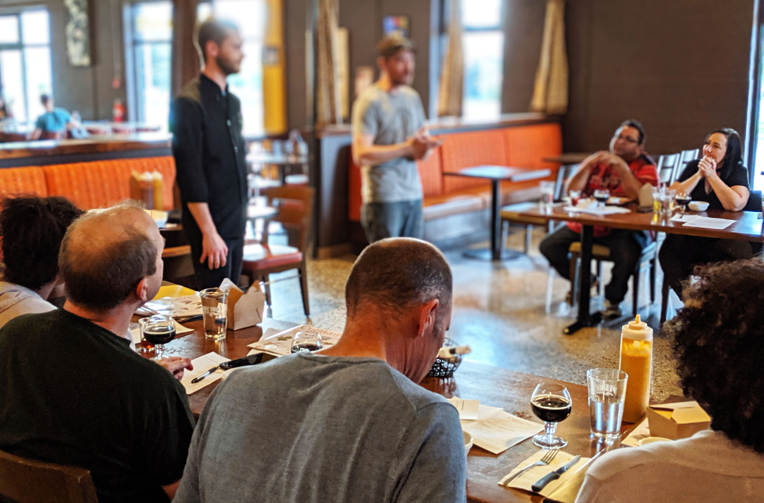 Guests tasting beer while Prairie Dog Brewing's Chef speaks at Barrelpalooza Brewmaster's dinner.
