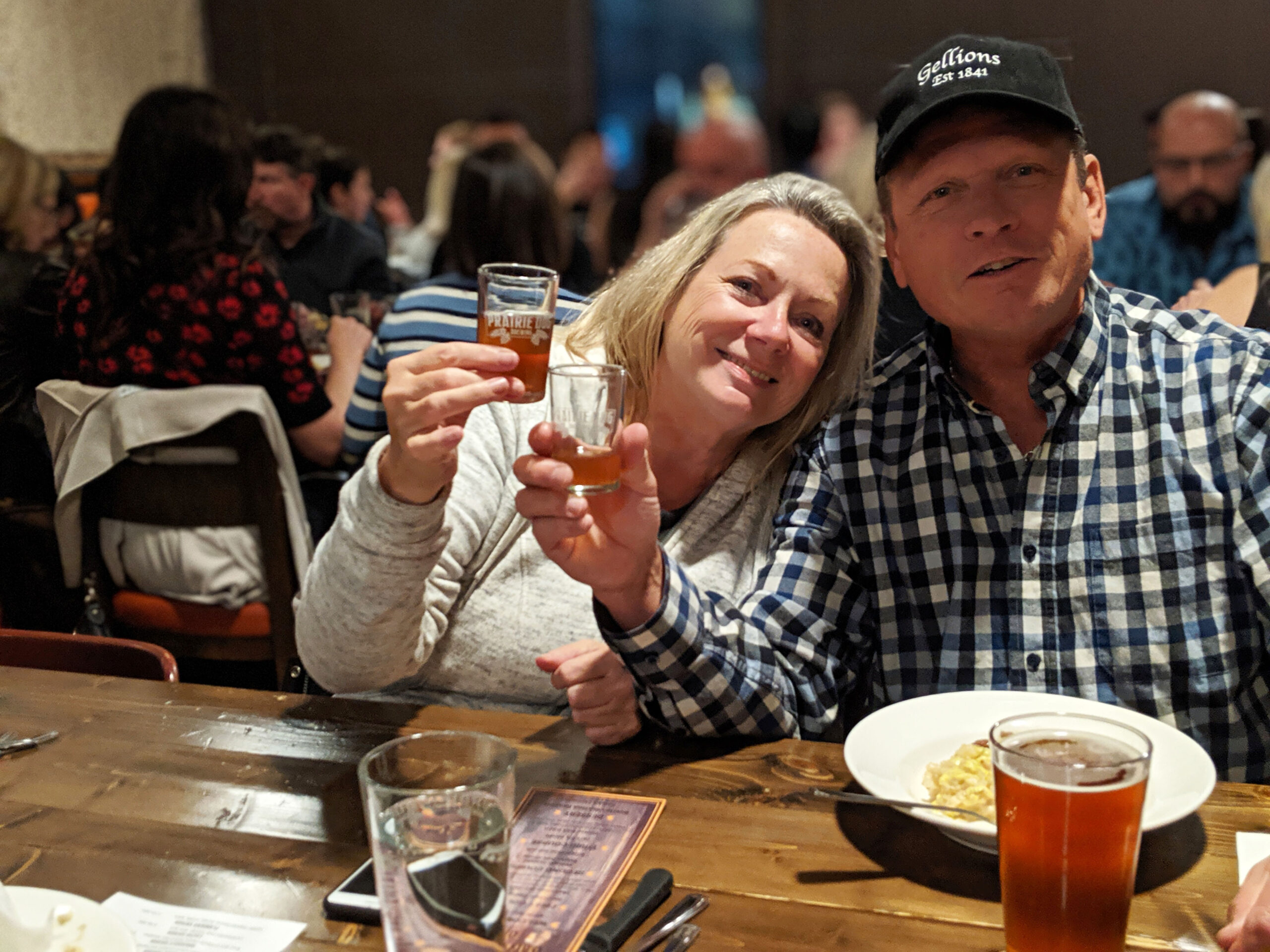 Couple cheers'ing during Barrelpalooza Brewmaster's Dinner event at Prairie Dog Brewing.