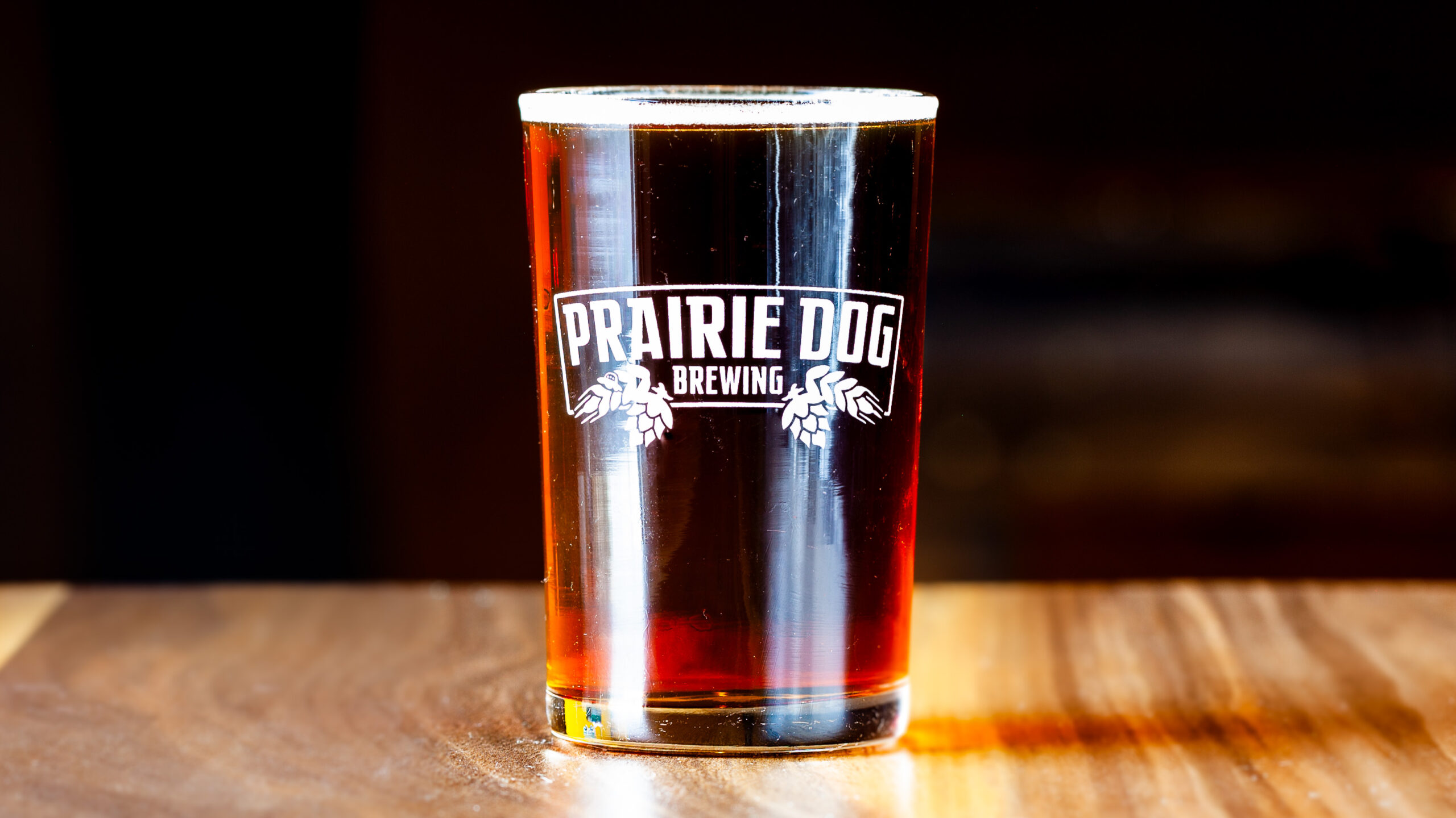 A 150mL draft pour of Prairie Dog Brewing's Gunnison's Red Ale.