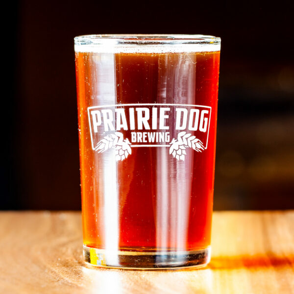 A 150mL draft pour of Prairie Dog Brewing's Coconut Brown Ale.