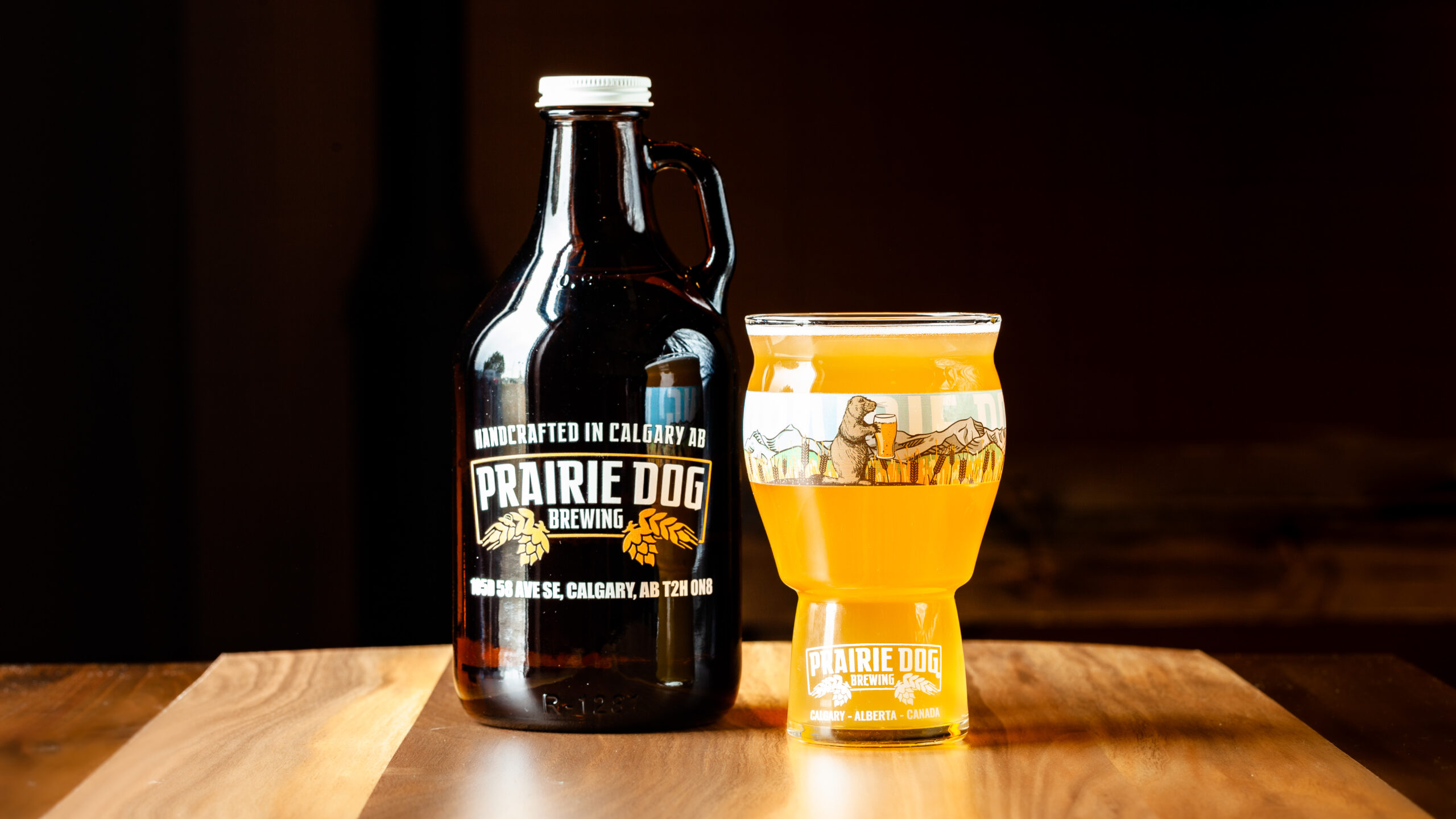 946mL howler jug of Prairie Dog Brewing Strait-Laced Saison with a 473mL draft pour.