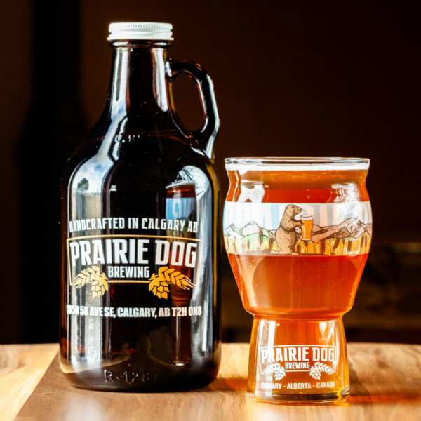 A 946mL howler jug of Prairie Dog Brewing's Jitter Bear Coffee Kölsch with 473mL draft pour.