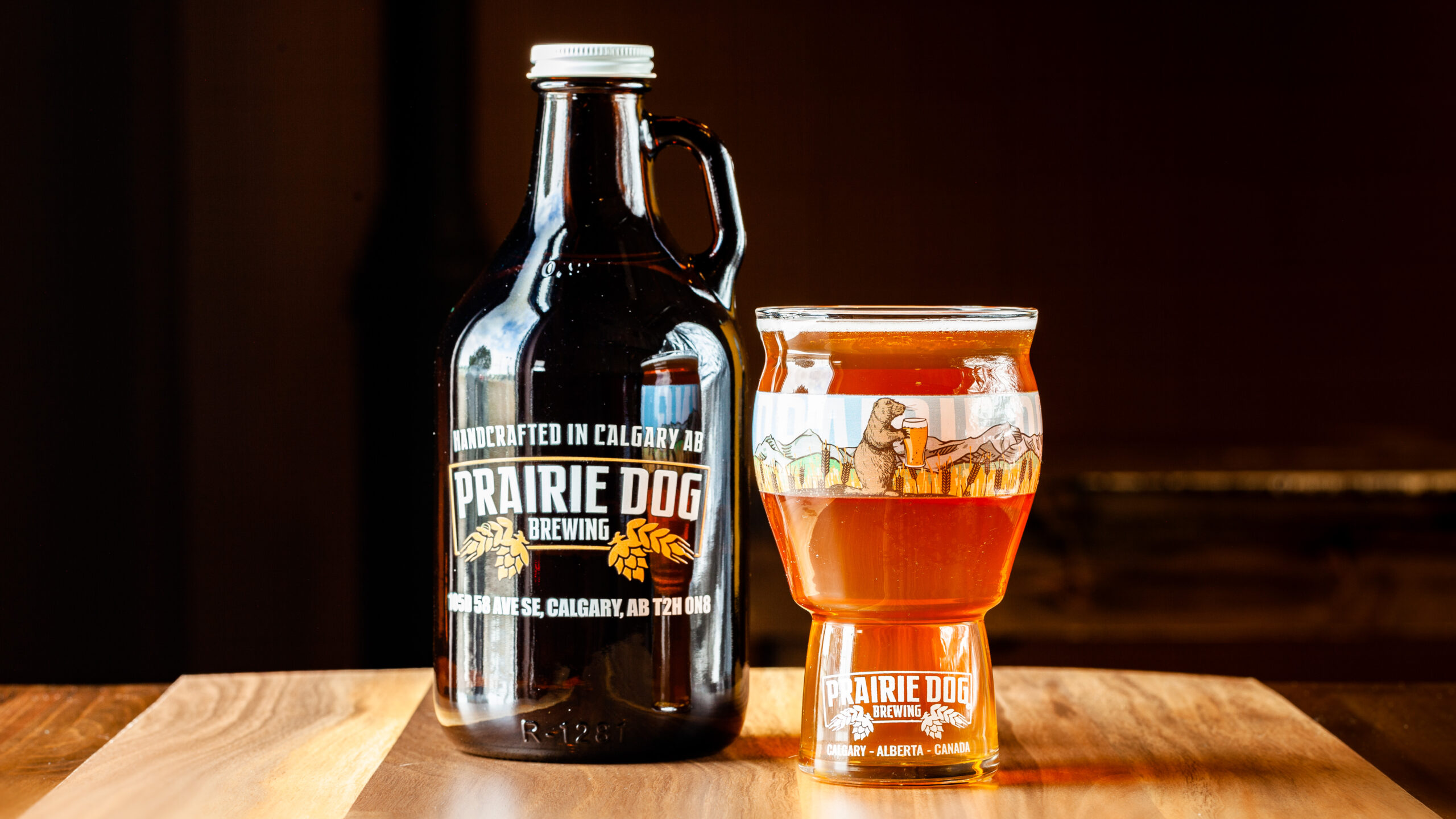 A 946mL howler jug of Prairie Dog Brewing's Jitter Bear Coffee Kölsch with 473mL draft pour.