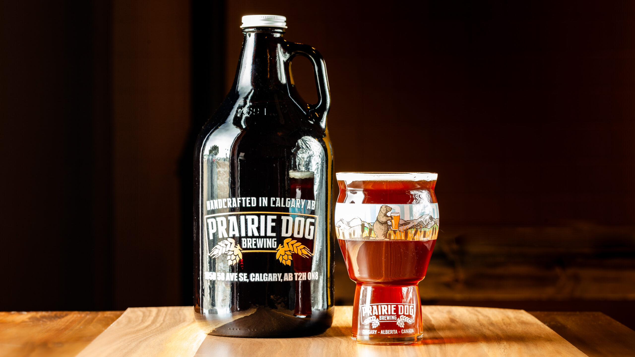 Prairie Dog Brewing's Supinator Doppelbock in a 1.89L growler jug and 473mL draft pour.