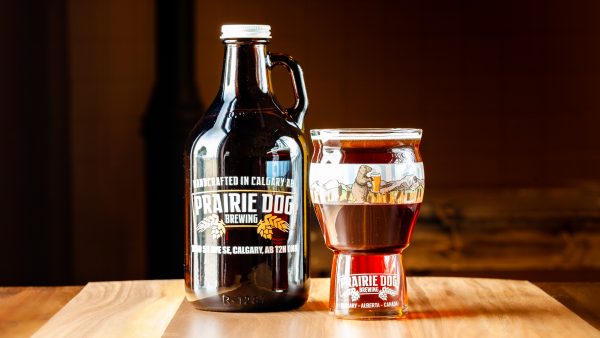A 946mL howler jug and 473mL draft pour of Prairie Dog Brewing's Coconut Brown Ale