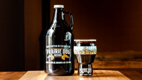 A 1.89L growler jug and 473mL draft pour of Prairie Dog Brewing's porter.