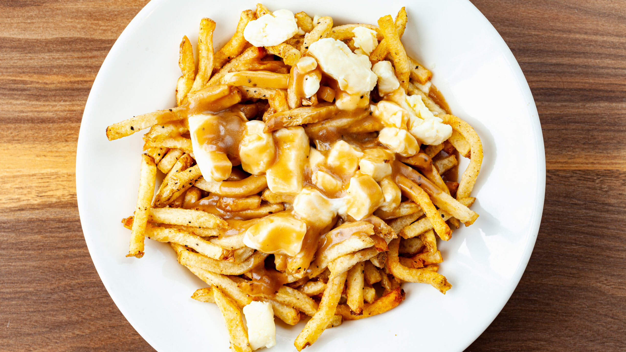 Poutine With Non-Fried Crystal Springs Cheese Curds Prairie Dog Brewing's poutine dish with Crystal Springs Cheese curds served plain instead of fried.