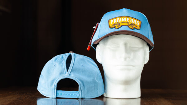 This Prairie Dog® Brewing hat is the perfect addition to any outfit. The blue is reminiscent of the prairie sky as it meets the prairie lands of the brown depicting the Alberta skies and fields where our beer ingredients, we all know and love! The slogan gives a nod to your favourite local brewery and lets everyone know what you like. A high notch in the top of the hat allows for a high ponytail to come out the top of the hat.