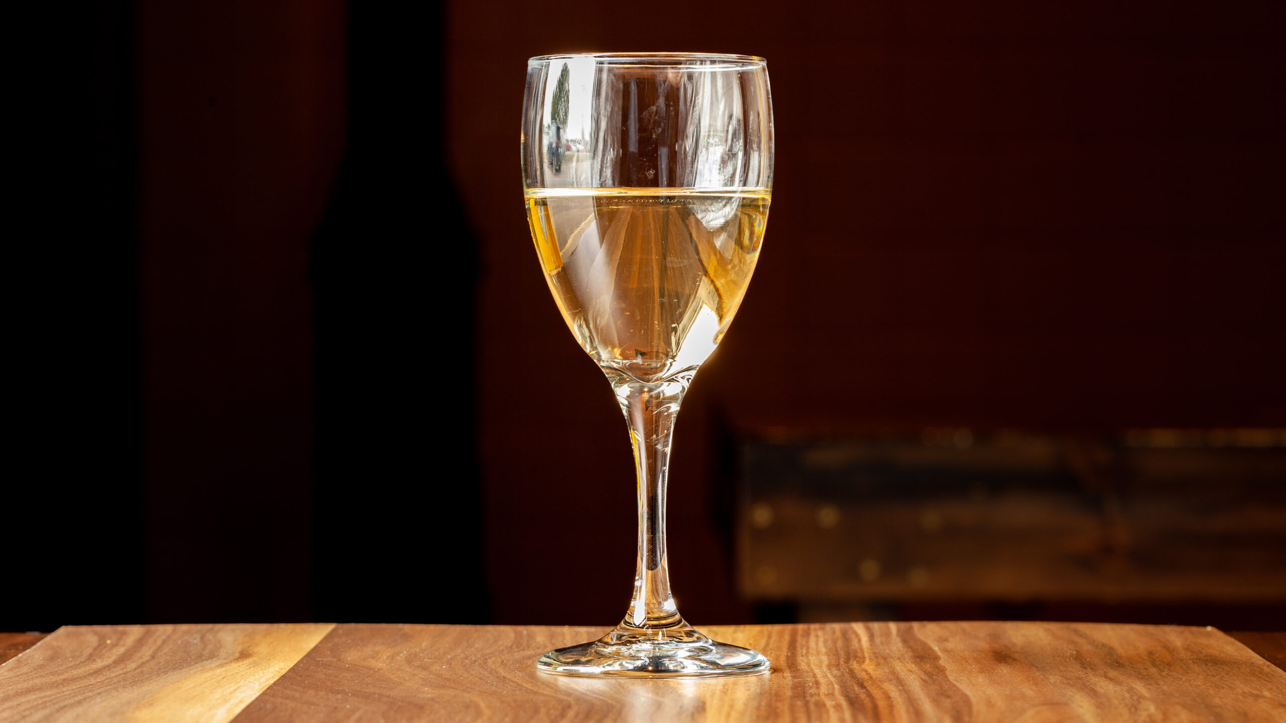 A glass of bota box pinot grigio white wine.