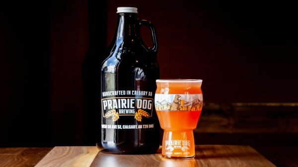 A 1.89l growler fill and 473ml draft pour of Prairie Dog Brewing's Treasures Berried Beer.