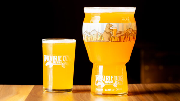 Prairie Dog Brewing's Philpotts Honey Chamomile Wheat Ale in two sizes of draft pour - 5oz and 16oz.
