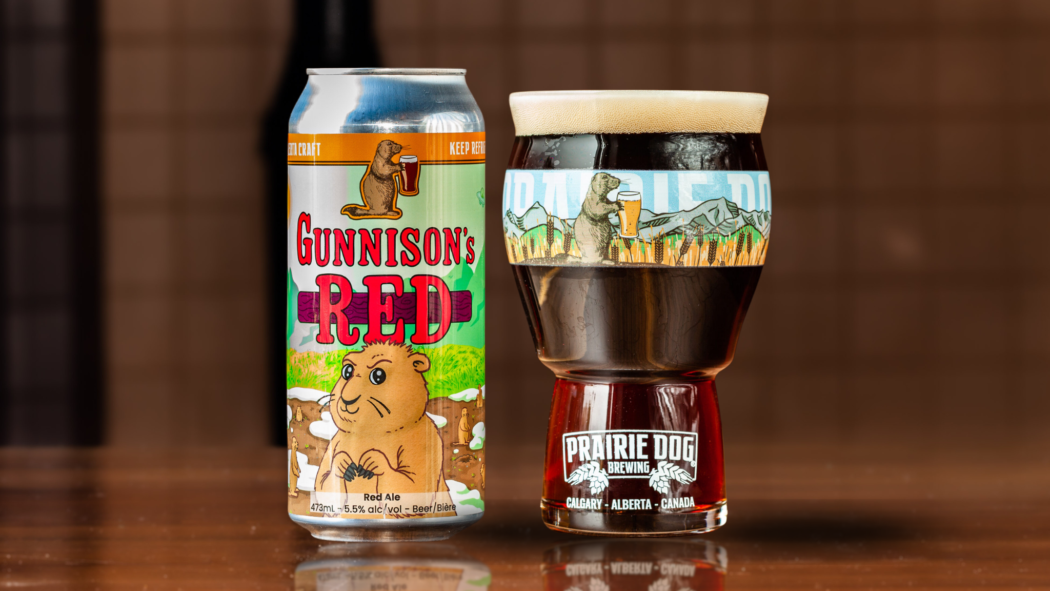 Gunnison's Red Can + Glass A 16-oz glass of Prairie Dog Brewing Gunnison's Red ale.